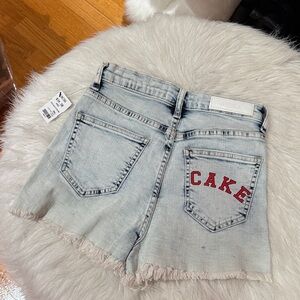 Akira Small Cake Light Wash Denim Shorts with Red Logo